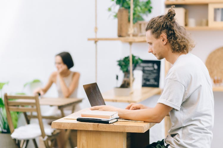 Man Browsing On Laptop