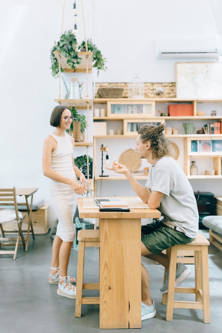 Man And A Woman Having A Conversation