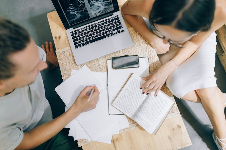 Man And A Woman Working Together