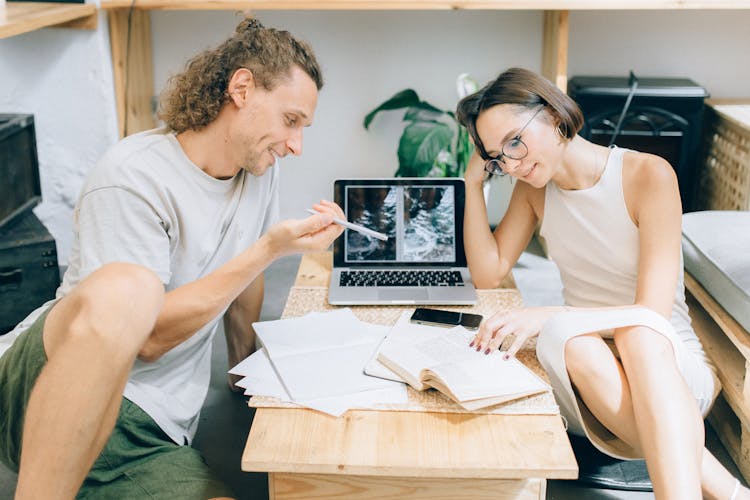 Man And A Woman Working Together