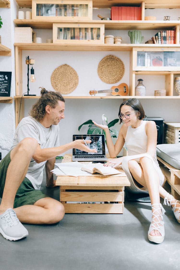 Man And A Woman Discussing Work