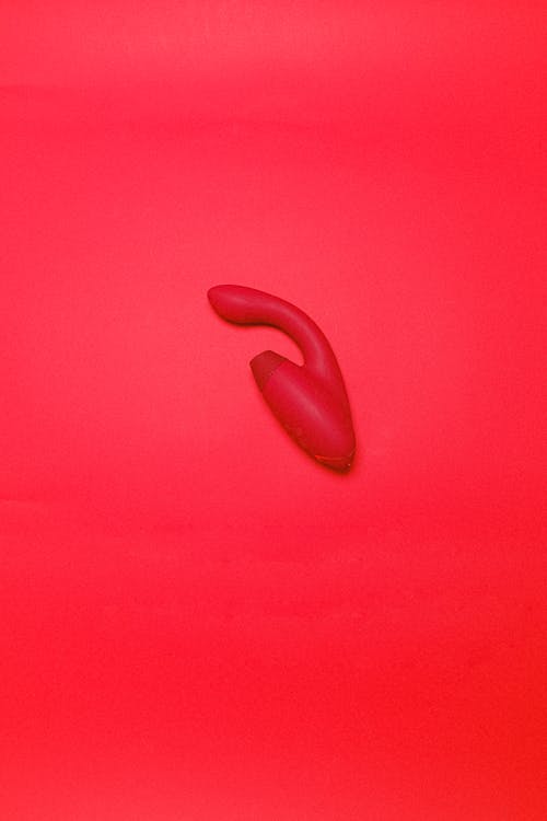 Free Sex Toy on a Red Background Stock Photo