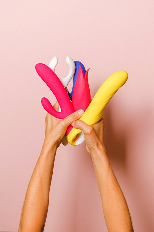 Free Hands Holding Sex Toys Stock Photo