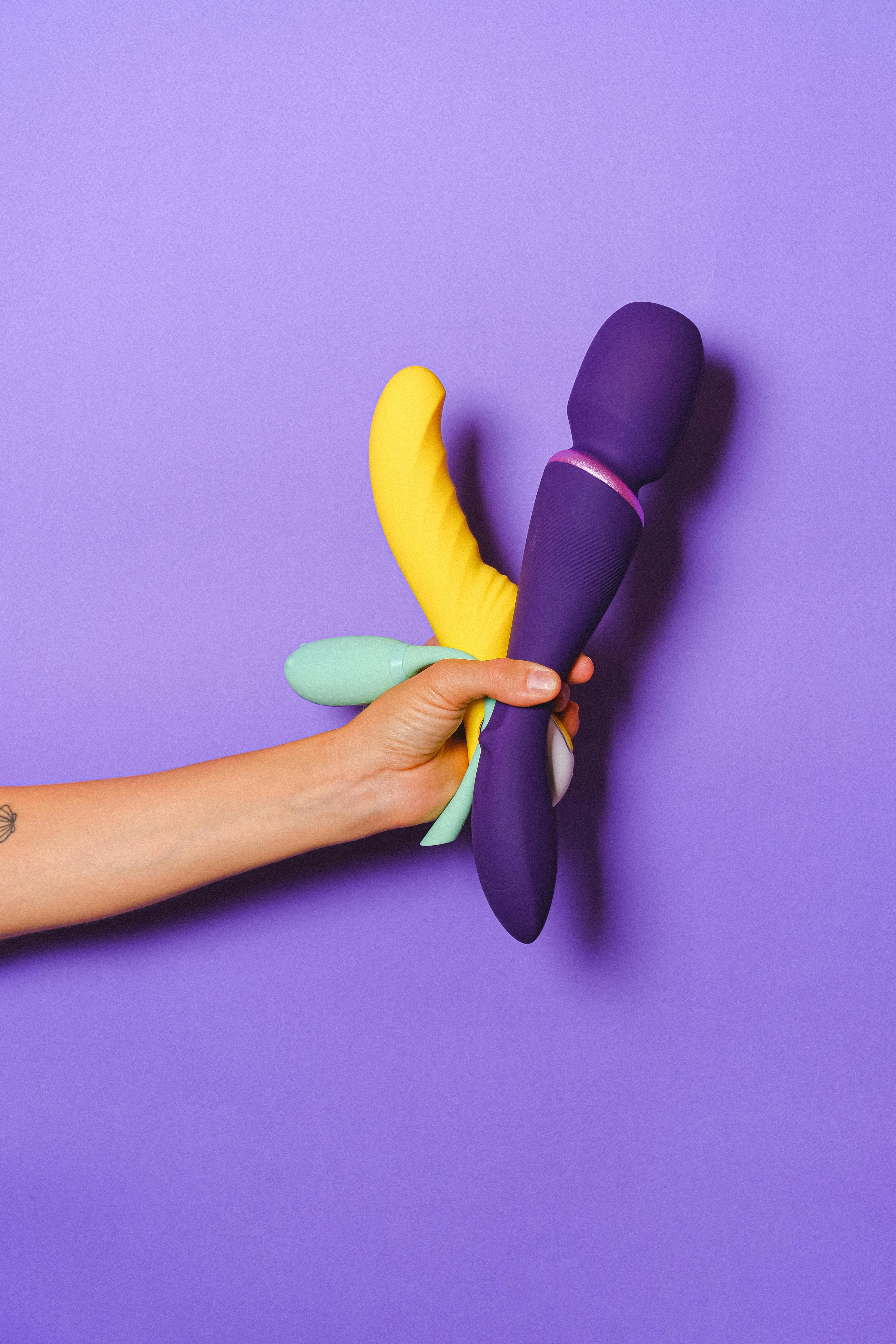 hand holding sex toys