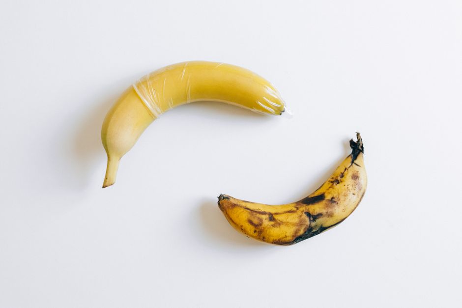 A conceptual image of a banana wrapped in protection next to an aging banana, symbolizing safety.