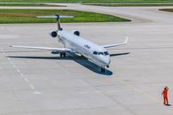 Person Standing in Front of Air Plane