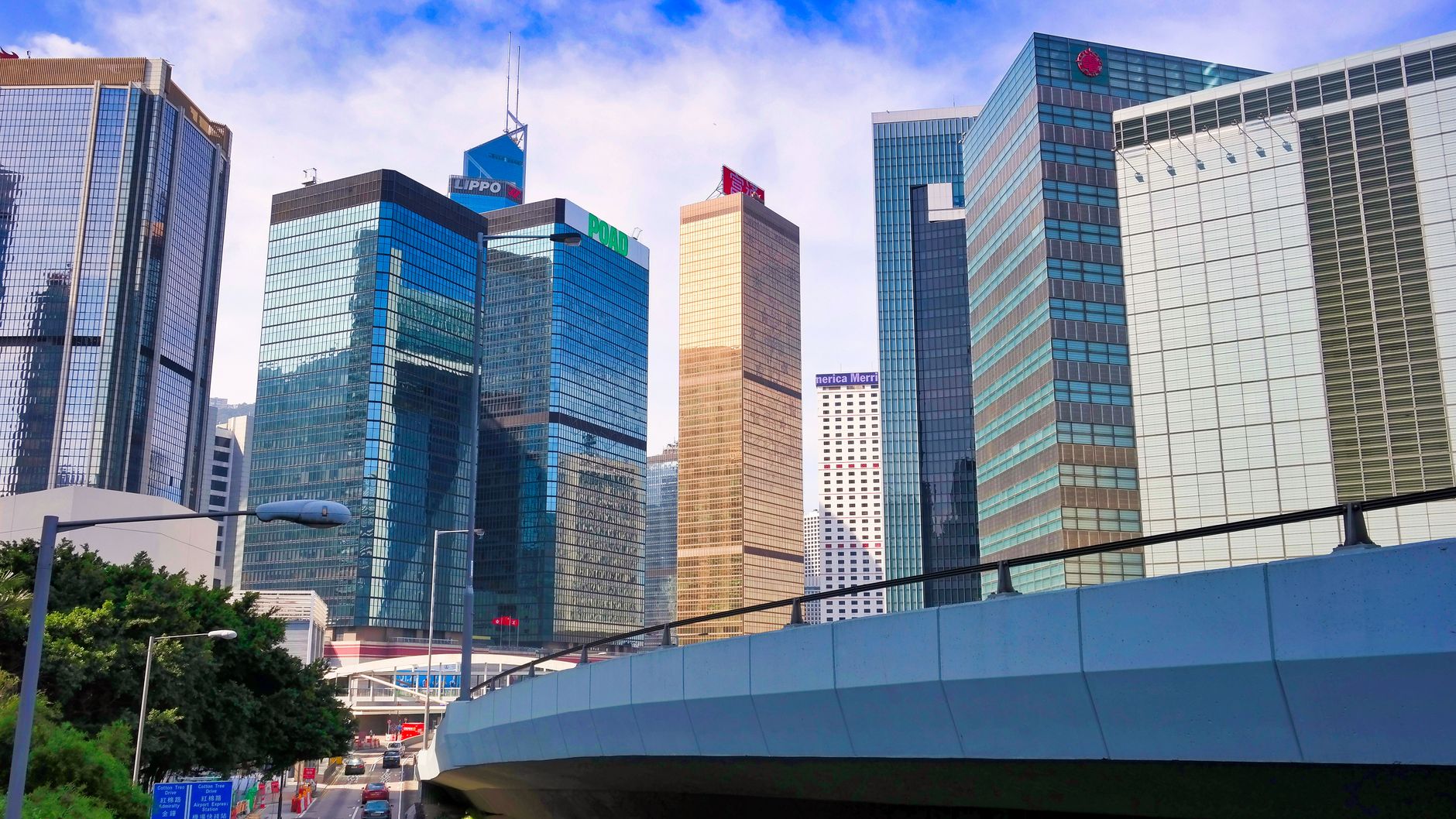 Stunning view of Hong Kong's vibrant skyscrapers and urban architecture under a blue sky.