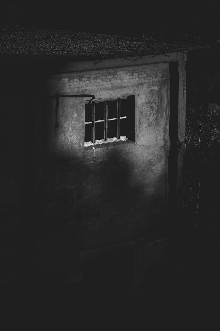 Aged Abandoned Stone House In Countryside At Night