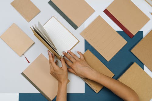 Person Flipping the Pages of a Planner