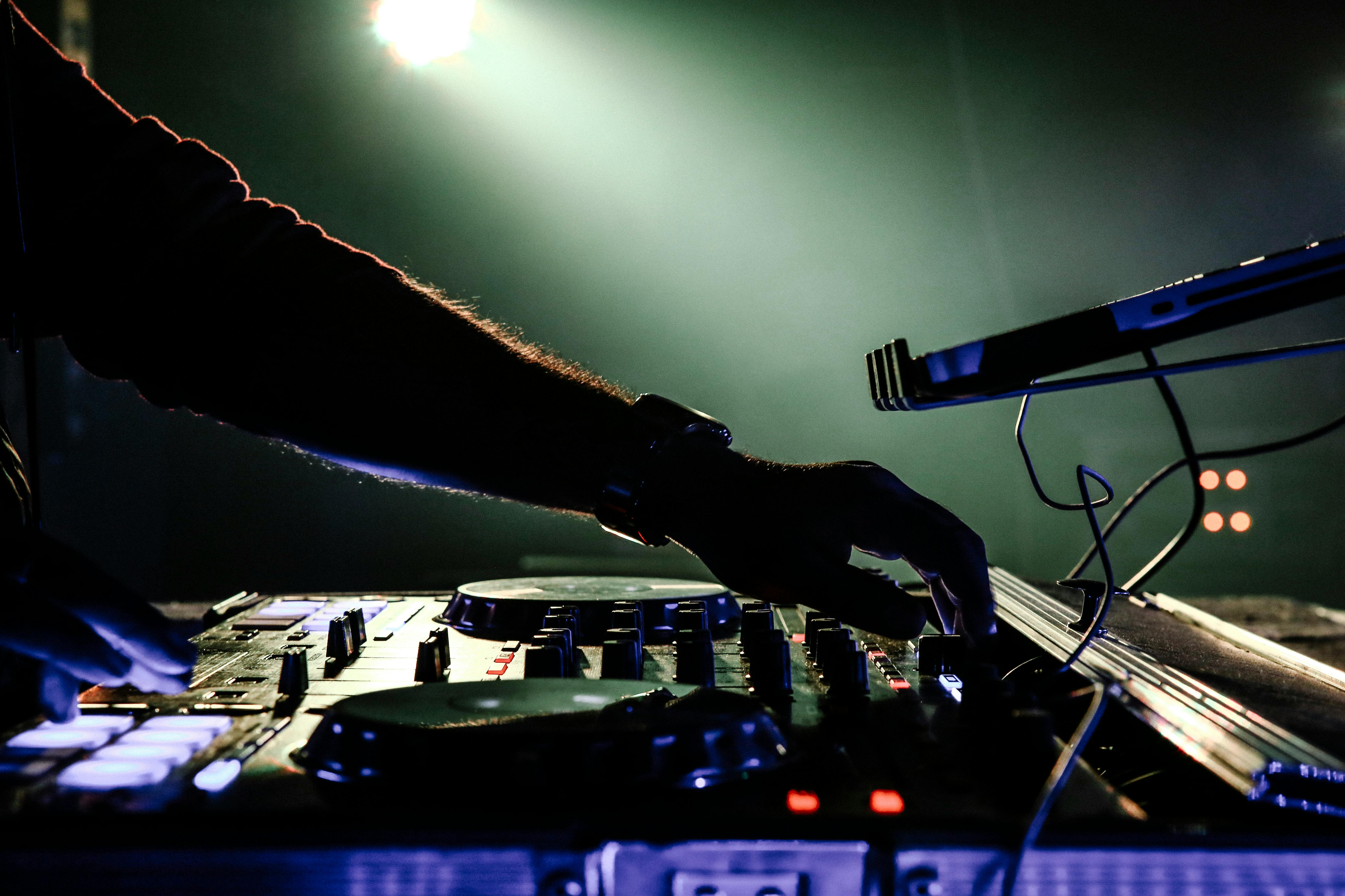 Hand on DJ Device · Free Stock Photo
