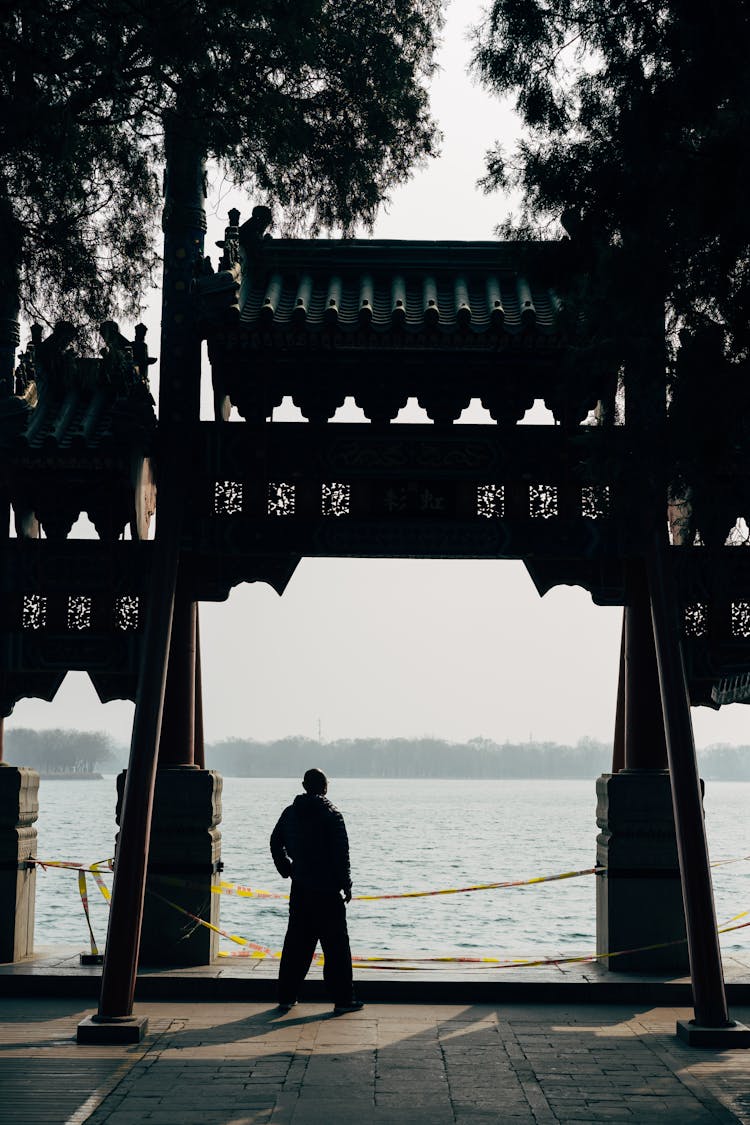 Silhouette Of A Person Looking At Sea