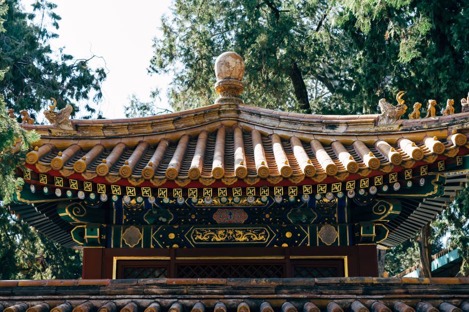 Ornate traditional Chinese pagoda roof in Beijing, showcasing intricate architecture and cultural heritage.