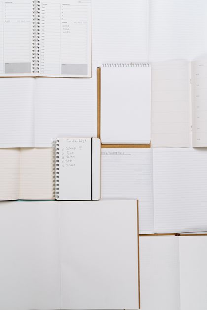 Open blank notebooks and planner pages arranged edge to edge — photo by cottonbro studio on Pexels