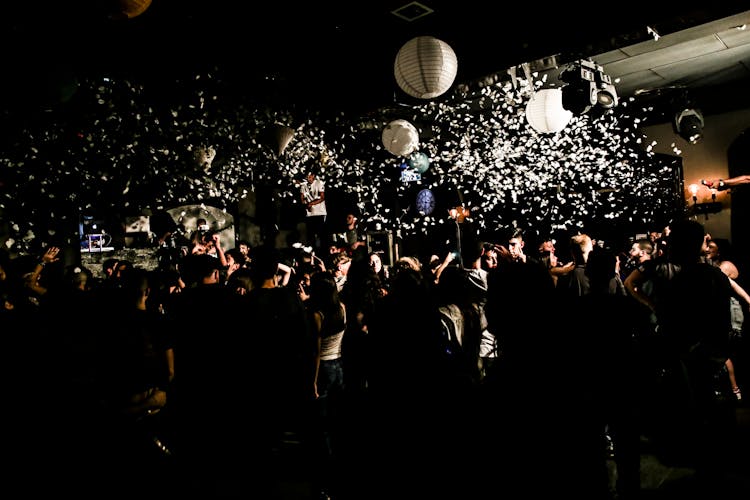 Confetti Falling Above The Dancing Crowd At A Nightclub