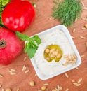 Hummus with Pine Nuts and Mint Leaves Garnish