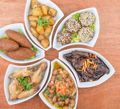 A top view of assorted Middle Eastern meze platters with various delicious dishes.