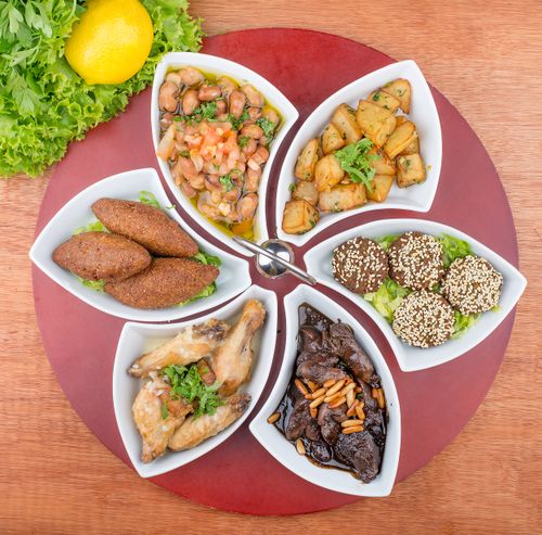 Free A top view of a mouthwatering Mediterranean appetizer platter with assorted dishes. Stock Photo