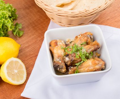 Ailes de poulet au cumin, au citron et à l'ail