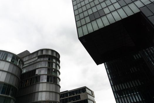 Black and White Concrete Building Under White Clouds