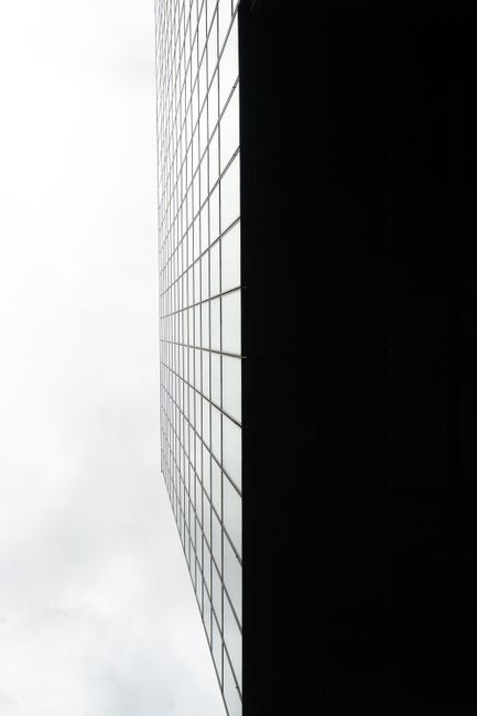 Low angle view of a skyscraper with a grid pattern in Düsseldorf, Germany.