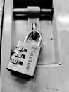 Silver Padlock on Glass Door