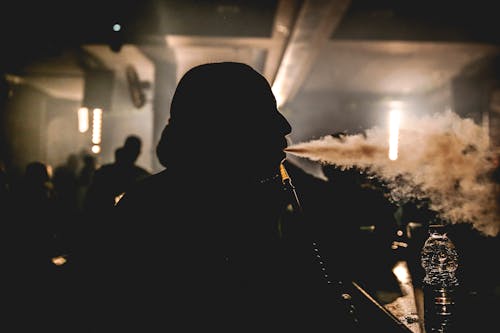 Man Smoking Shisha in Bar 