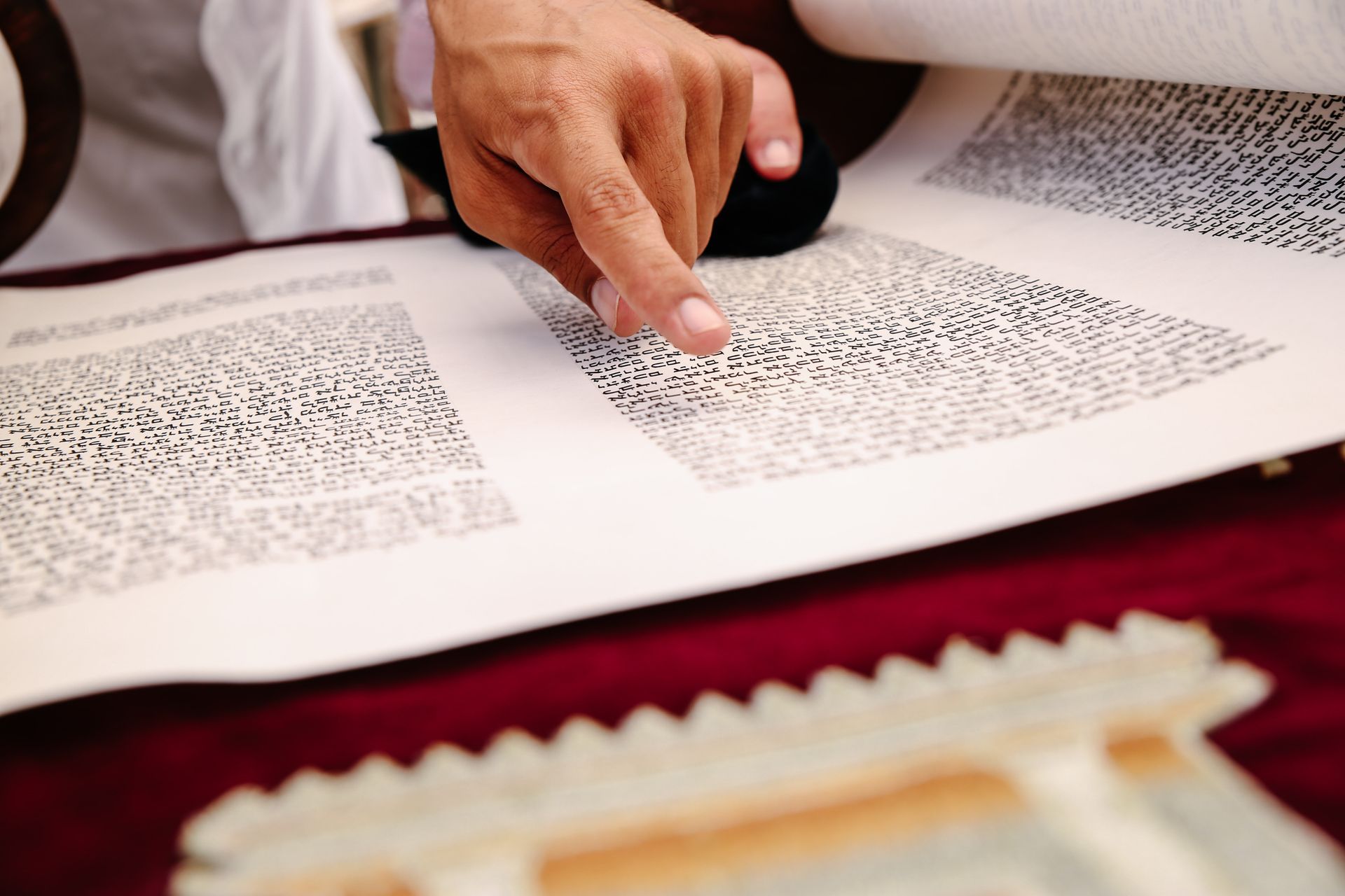 Close-up of Person Reading Old Scroll Book