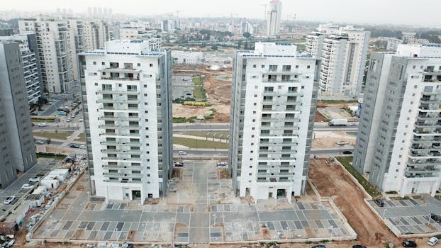 Aerial shot of contemporary residential buildings in Be'er Ya'akov, Israel, showcasing urban development.