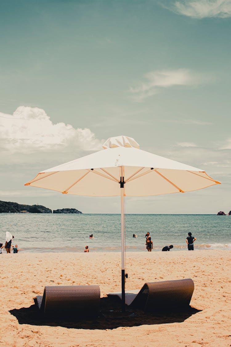 Chairs Under A Beach Umbrella