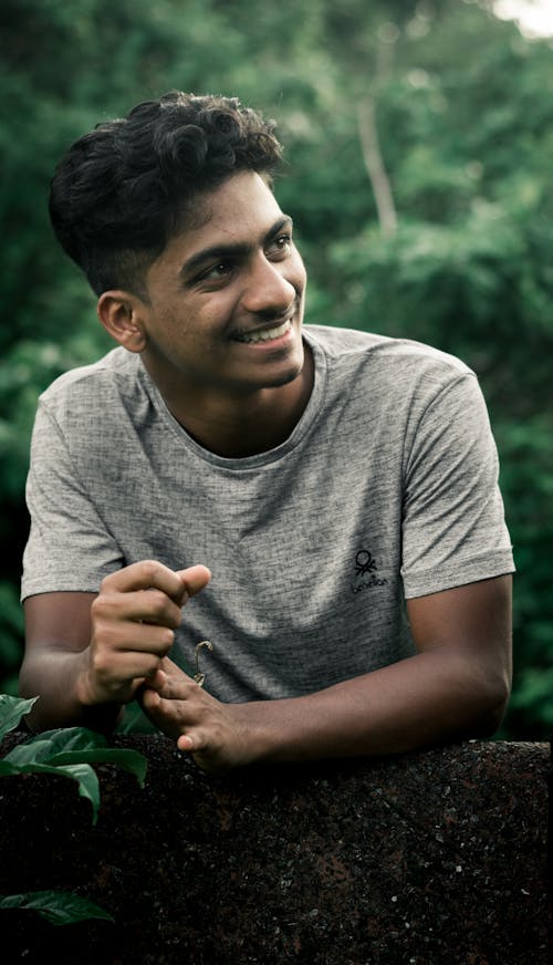 Young Man Smiling in Gray T-shirt