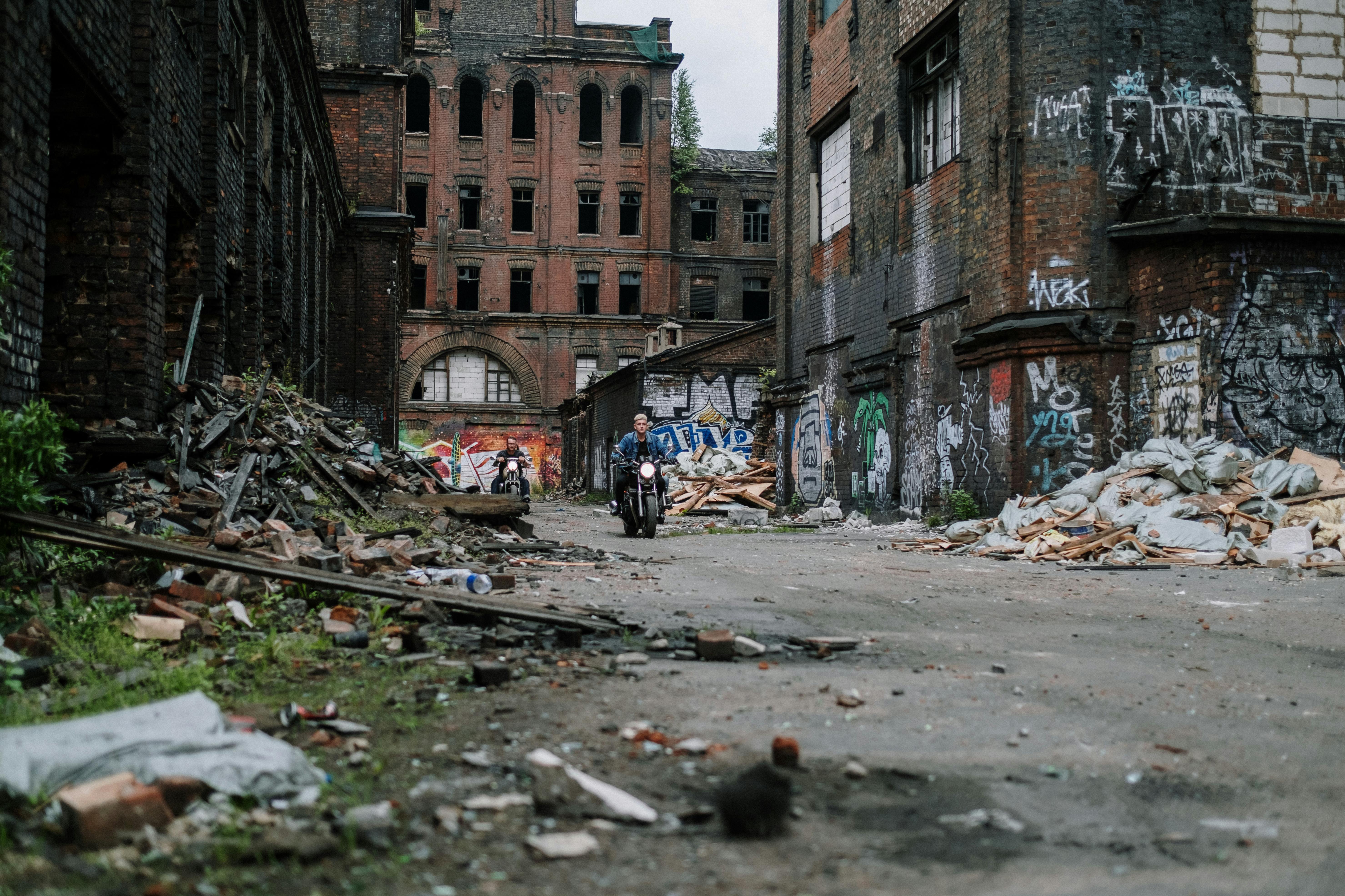 people walking on street near brown concrete building