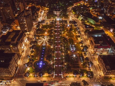 Stunning aerial view of illuminated Belo Horizonte cityscape at night, highlighting urban lights and architecture.