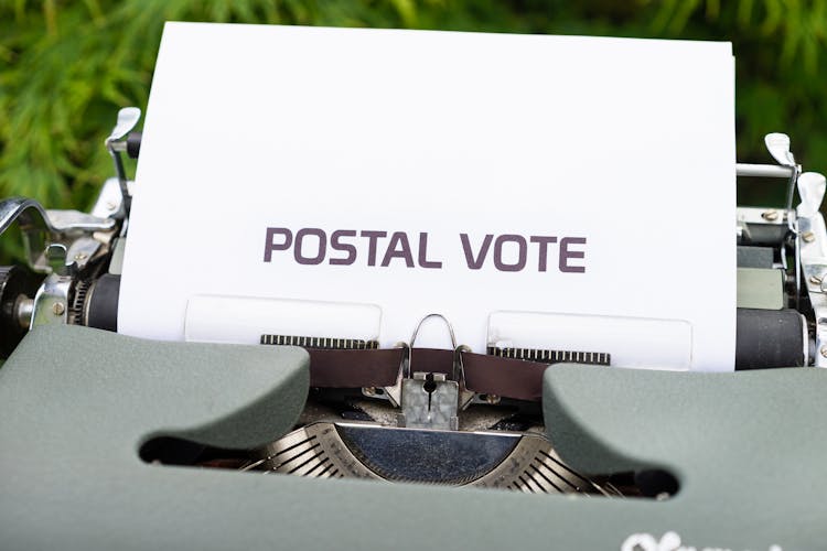 Paper With The Words Postal Vote In A Typewriter