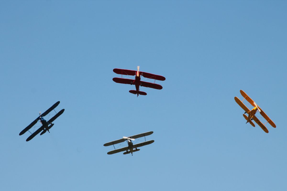 Biplanes flying in formation — the era of pioneering female aviators