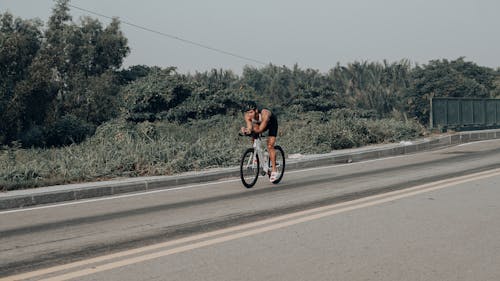 Free Man Riding a Bicycle Stock Photo