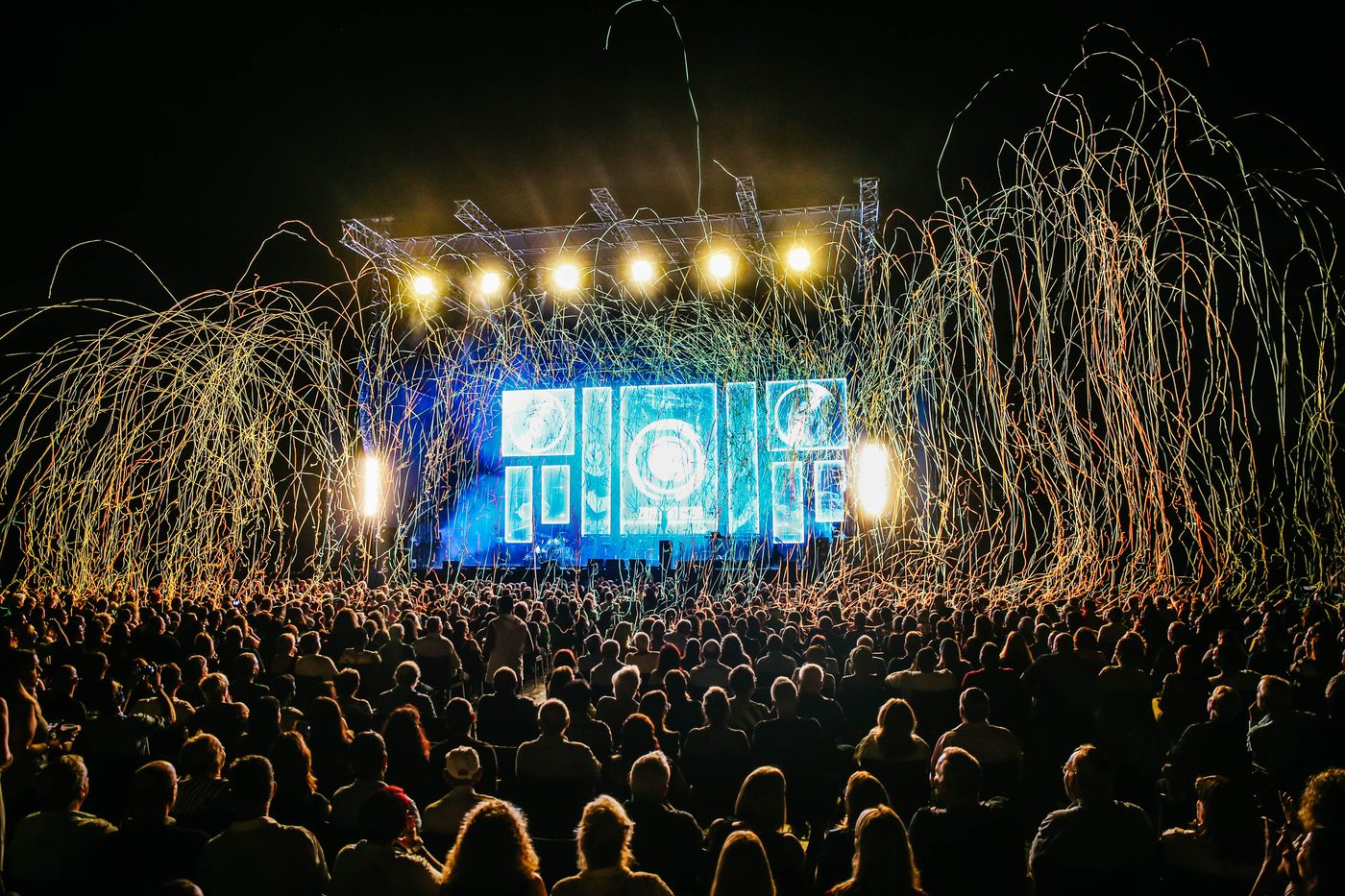 Festival crowd at an outdoor stage — photo by Maor Attias on Pexels