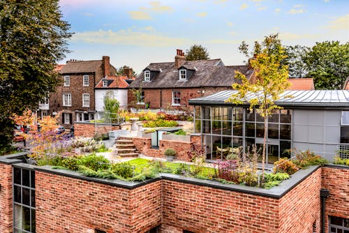 Free A Garden on the Roof of a Brick Building Stock Photo