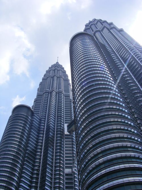 Free Majestic view of the iconic Petronas Twin Towers in Kuala Lumpur during daytime. Stock Photo