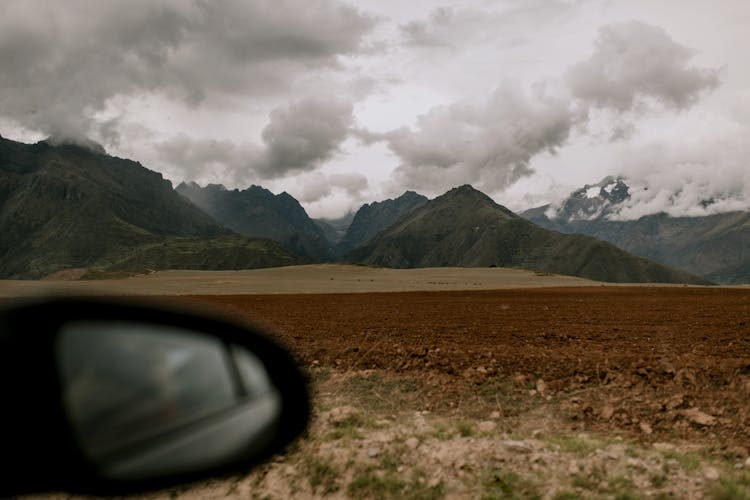 Mountain Landscape Of Cusco Under Cloudy Gray Sky