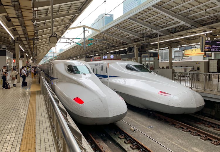 White Bullet Trains In Train Station