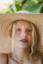 Woman Wearing Brown Woven Hat