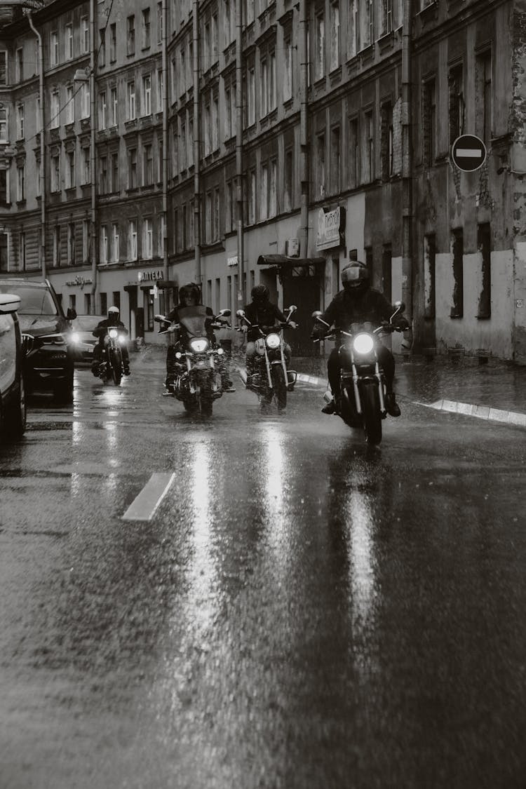 Group Of Motorcycle Rider On A Wet Road