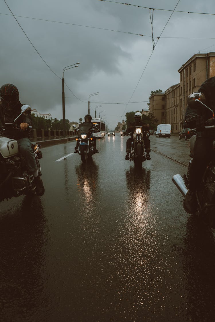 People Riding Motorcycles On The Road