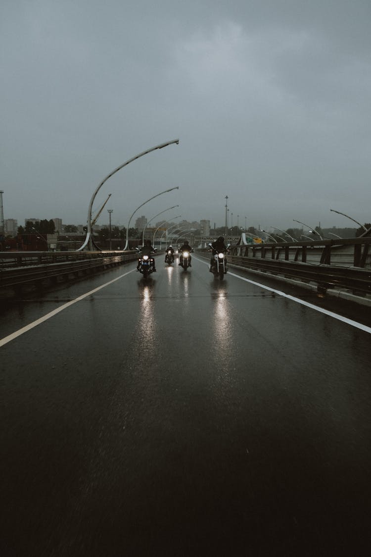 People Riding Motorcycle During Night Time