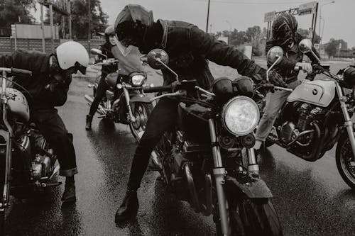 Men in Woman with Motorbikes Parked on the Road