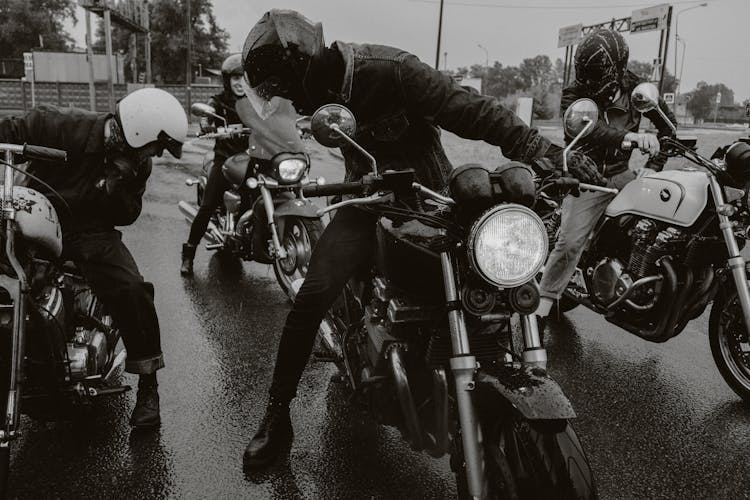 Men In Woman With Motorbikes Parked On The Road