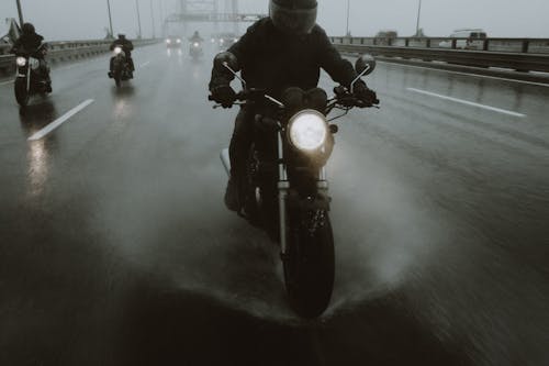 Riders Wearing Helmets Riding Their Motorcycles