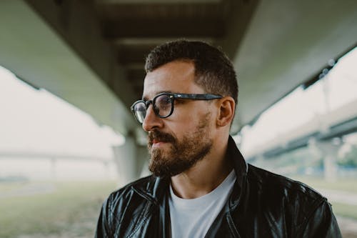 Close Up Photo of Bearded Man Wearing Eyeglasses