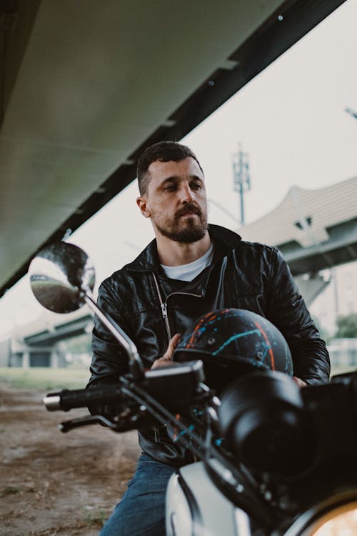 Man in Black Leather Jacket Sitting On  A Motorcycle