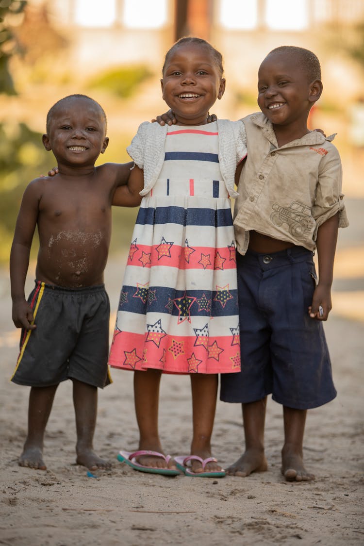 Smiling Black Children Standing On Street